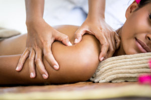 Close up of massager hands massage shoulder